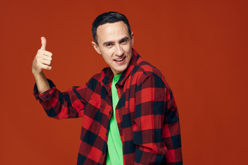 handsome young man showing thumbs up