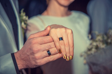 Newly wed couple's hands with wedding rings. Sign, symbol of new family concept