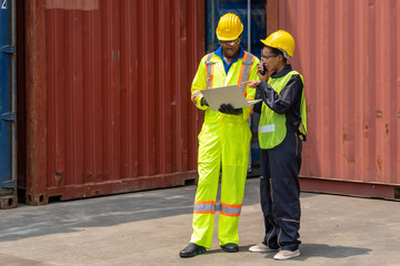 industrail background of african american containers yard and cargo inspector team working at containers loading area