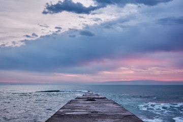 Obraz na płótnie Canvas Sunrise at the sea. Seascape of the morning dawn. Early morning on the beach.