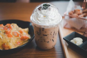 Iced coffee mocha topped with whipped cream