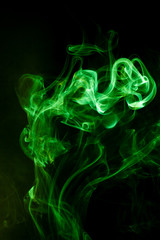 Green smoke motion on black background.