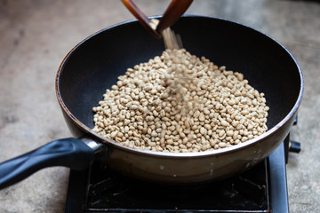 Traditional roasting coffee at home,  freshly roasted coffee beans.