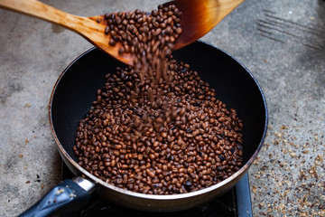 Traditional roasting coffee at home,  freshly roasted coffee beans.
