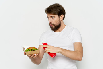 young man holding a red apple