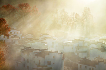 The morning fog on the dwellings of Anhui buildings in Wuyuan county Jiangxi province, China.