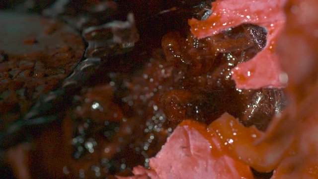 Chainsaw ripping into flesh-like object