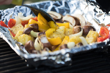 Close up of veggies cooking on grill