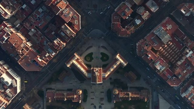 AERIAL: Barcelona Overhead Drone Shot of Typical City Blocks in Beautiful Sunlight with Urban Traffic 