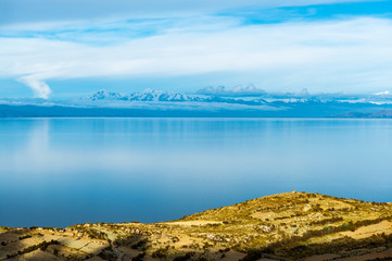 Sunset over the Titicaca Lake with the Cordillera Blanca or White Mountain Range in the background, Isla del Sol, Bolivia.