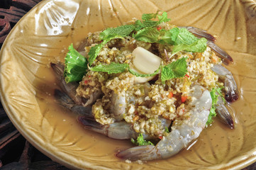 Shrimp with Spicy Fish Sauce in green plate on the table.