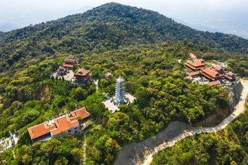 Ba Na Nui Chua peak on Ba Na Mountain. With " Linh Phong Tu " temple, Linh Phong tower, Lau Chuong, Bia houses and Ba temple. Near Golden bridge. Da Nang, Vietnam 
