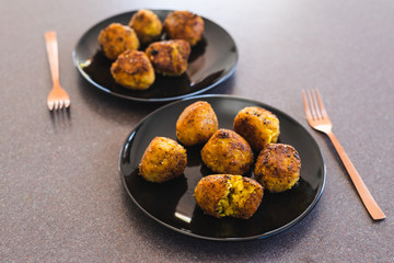 plant-based food, deep fried risotto arancini balls with vegan cheese filling