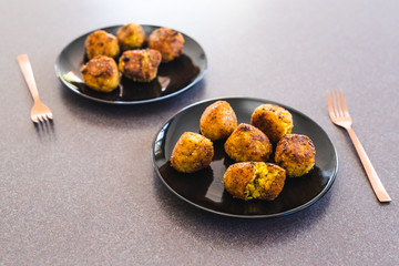 plant-based food, deep fried risotto arancini balls with vegan cheese filling