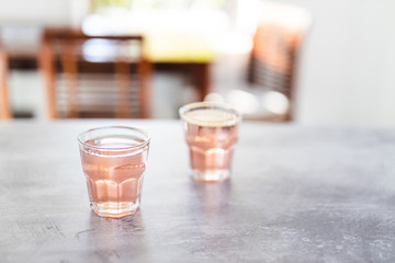  two glasses with non-alcoholic pink lemon lime bitter drink
