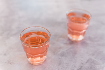  two glasses with non-alcoholic pink lemon lime bitter drink