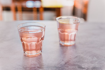  two glasses with non-alcoholic pink lemon lime bitter drink