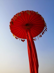 The red umbrella is beautifully decorated in bright clear sky