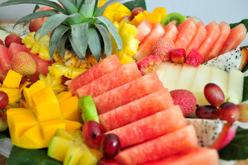 Exotic sliced fresh fruits platter arrangement