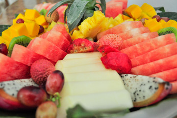 Exotic sliced fresh fruits platter arrangement