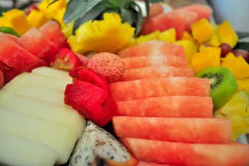 Exotic sliced fresh fruits platter arrangement