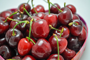 Pile of fresh red cherries with stems