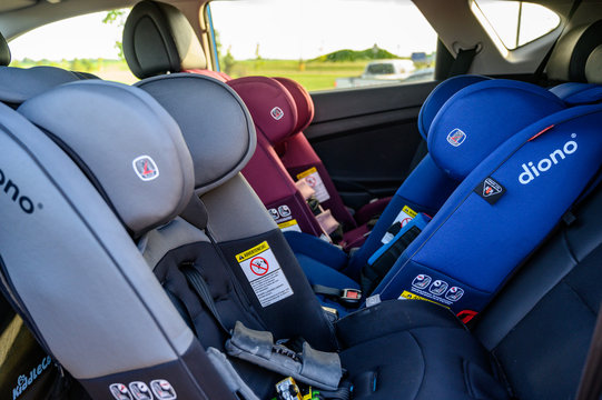 Tiffin, Iowa, USA - 7/2019: Row Of Rear And Forward Facing Diono Car Seats In Back Seat Of SUV