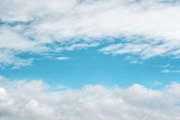 Naklejka na ściany i meble Clouds on bright blue sky background , copy space