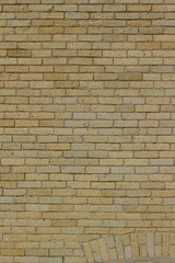 Shabby chic old yellow brick wall texture background with natural weathered appearance