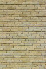 Shabby chic old yellow brick wall texture background with natural weathered appearance