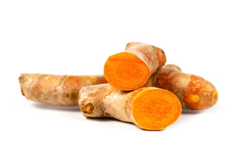 Close up of cutting of turmeric roots on white background, Herbs