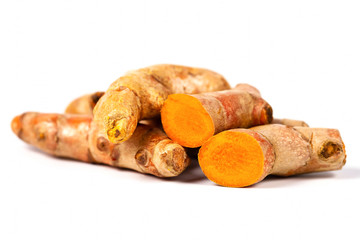 Close up of cutting of turmeric roots on white background, Herbs