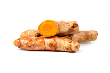 Close up of cutting of turmeric roots on white background, Herbs