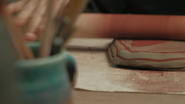 Ceramist work in the workshop.
