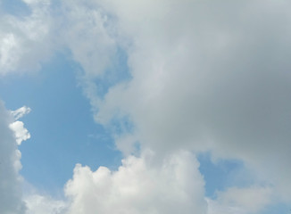 Blue sky and clouds backgrounds and textures closeup for wallpaper interior design. In Samut Sakhon, Thailand.