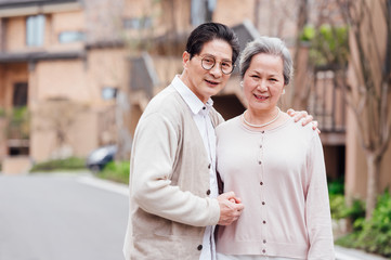 Asian aged couple walking in the area