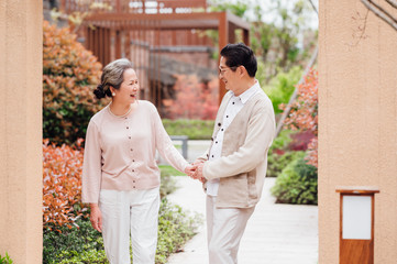 Fototapeta premium Asian aged couple walking in the area