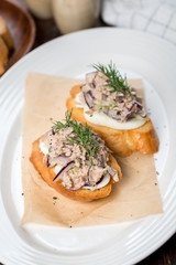 Bruschetta with liver on a white glass plate