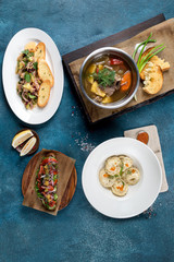Several dishes in the frame of ear, dumplings, snacks and sandwiches