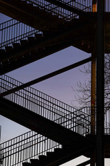Fototapeta na wymiar Stockholm, Sweden Stairs in silhouette under the Liljeholmen bridge.
