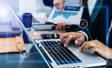 
Working team meeting concept, business using laptop and smart phone and digital tablet computer with digital marketing media  in virtual icon network diagram office in morning light
