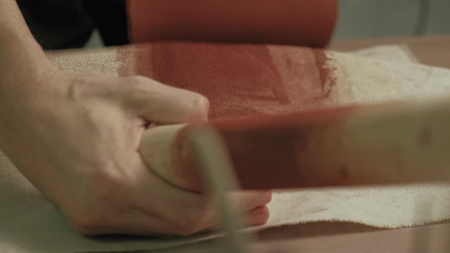 Ceramist work in the workshop.
