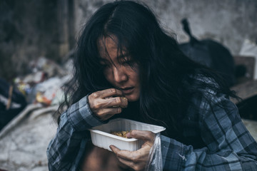 poor people or beggar begging you for help sitting at dirty slum.concept for poverty or hunger...