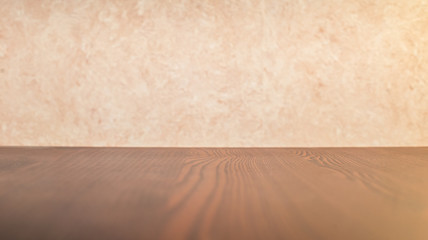 Empty brown wooden table surface on a light background. Small depth of field