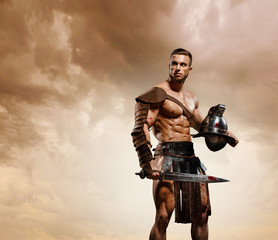Gladiator fighting on the arena of the Colosseum on dramatic light. Roman Hoplomachus armed fighter Concept historical photo - obrazy, fototapety, plakaty