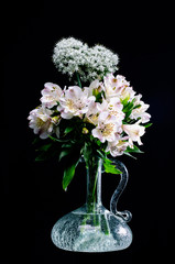 Flower arrangement on black backdrop
