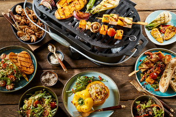 Various healthy dishes and vegetables on grill