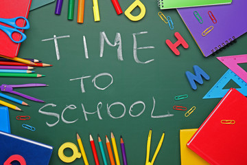 Set of supplies with text TIME TO SCHOOL on color background
