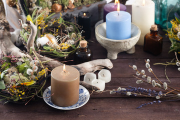 Easter still life with candles and decor. Easter holiday concept. Close-up.