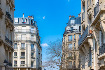 Paris, typical facades and windows, beautiful buildings in Montmartre
